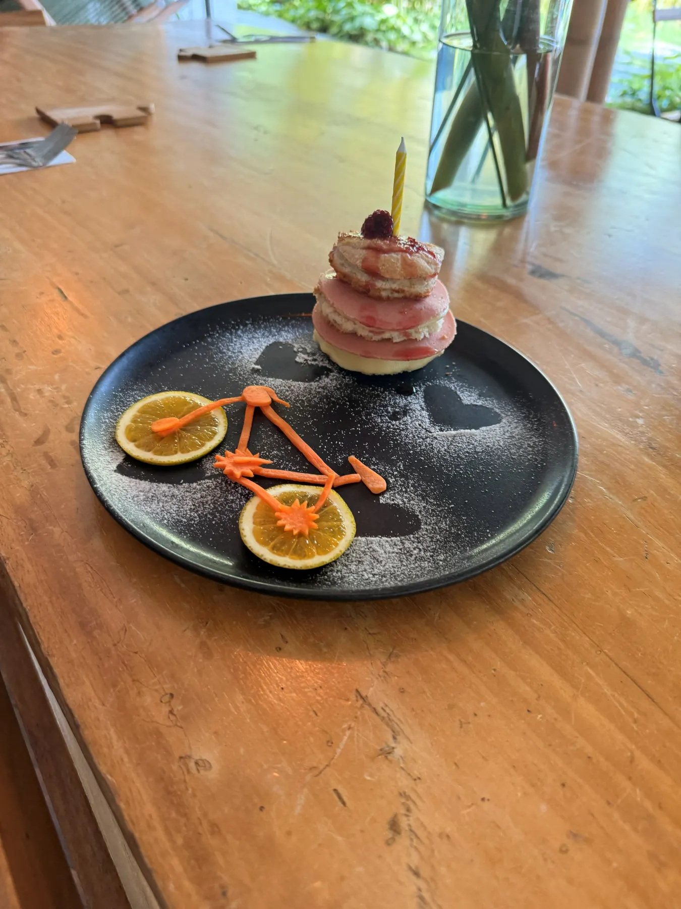 Layered dessert with fruit on a plate at the restaurant bar