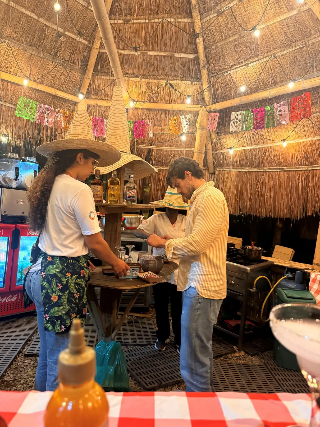 Taco Stop’s bar with a green checked cloth and a waiter in a sombrero