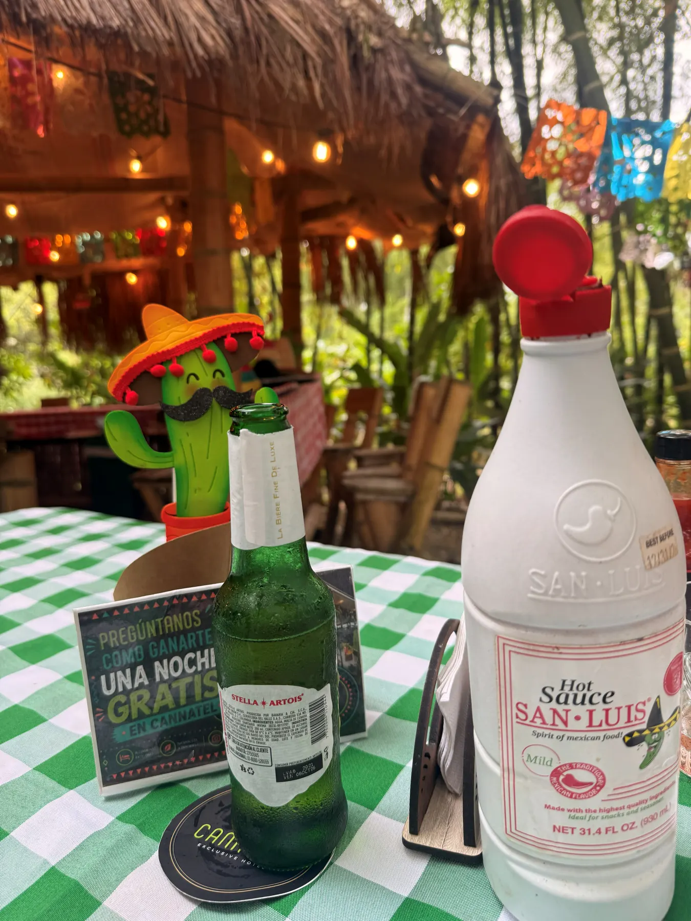 Sauce bottles and drinks on the taquería bar