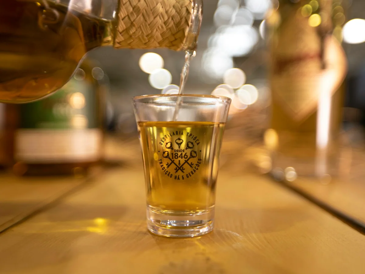 A shot being poured from a bottle
