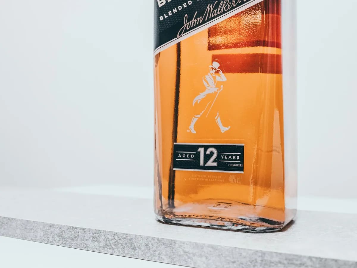 A bottle of Johnnie Walker Black Label against a white ground