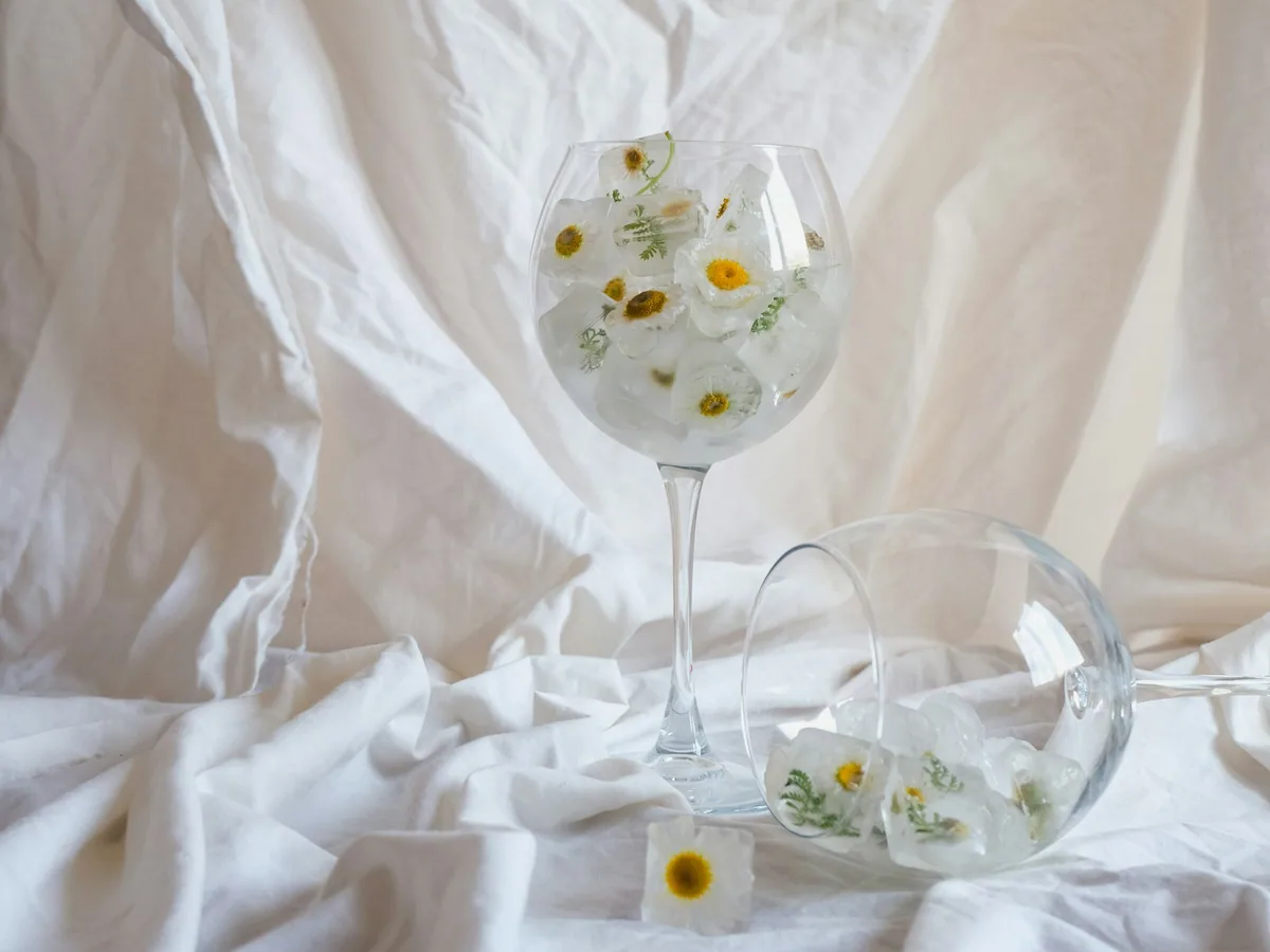 A gin glass with flowers and ice