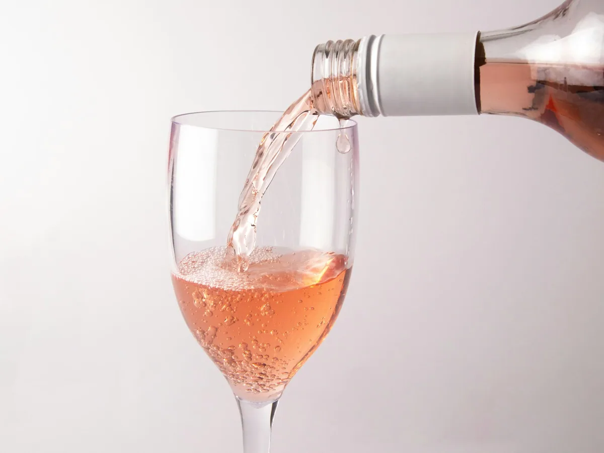 Sparkling rosé being poured into a glass