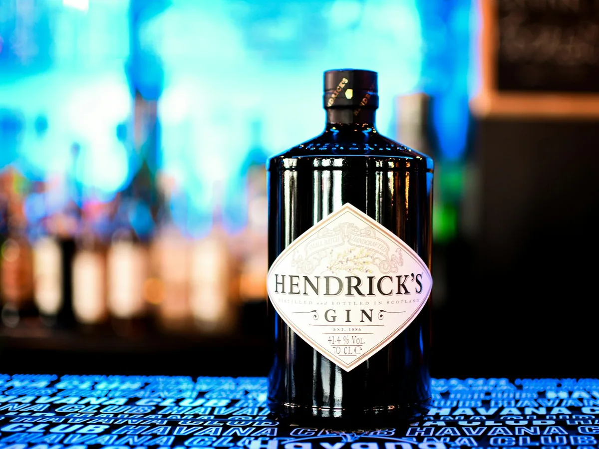 A bottle of Hendrick’s against a blue ground