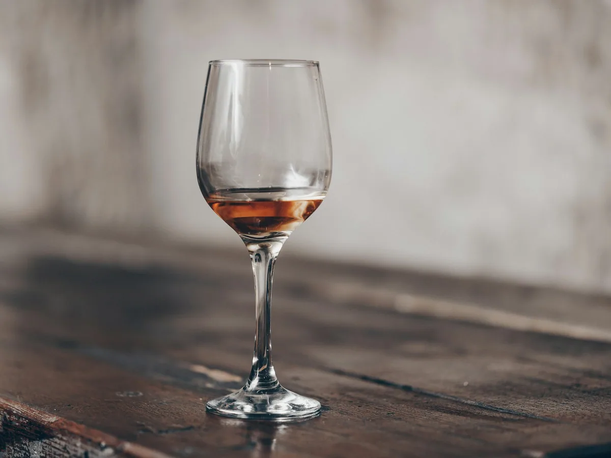 A small glass of amber liqueur