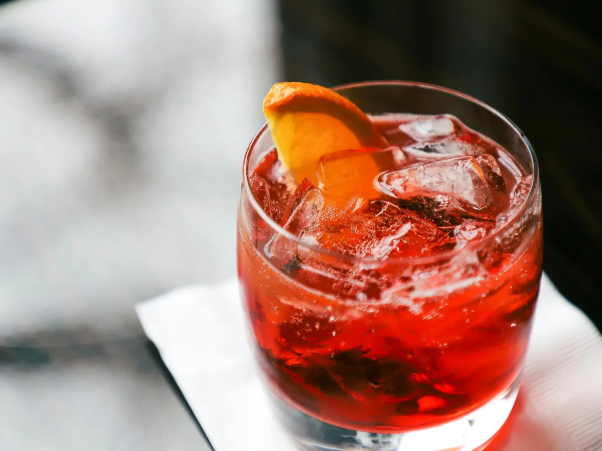 A negroni with ice and orange peel