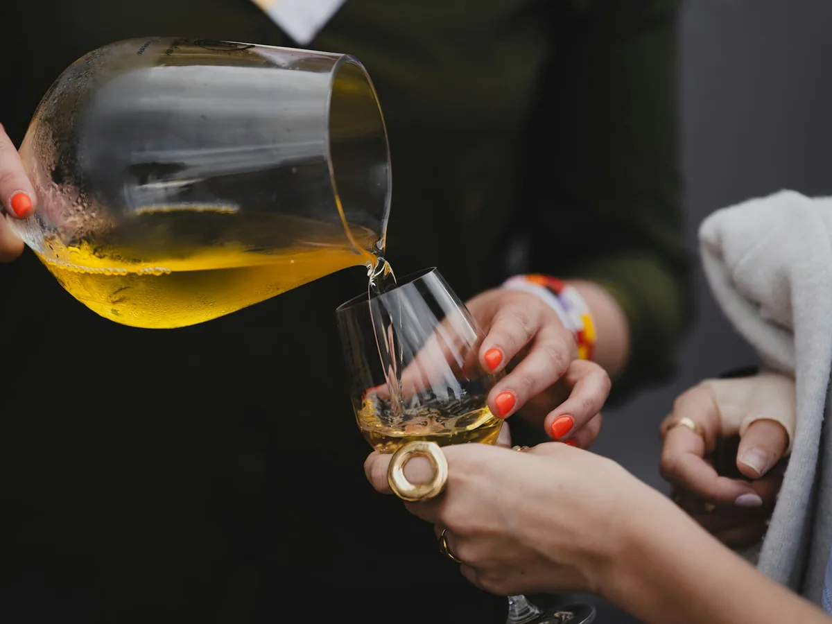 White wine being poured into a glass